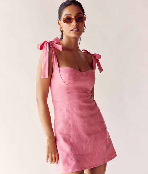 model wearing a baby pink dress