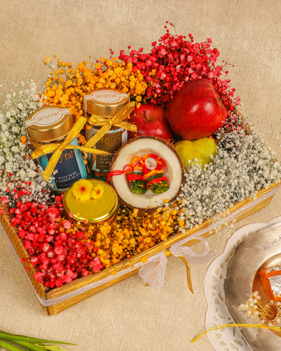 raksha bandhan gifting box with nuts, flowers and fruits