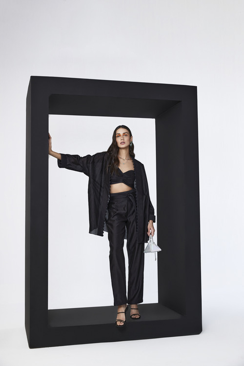 model wearing a black chanderi silk co-ord set by designer ridhi mehra