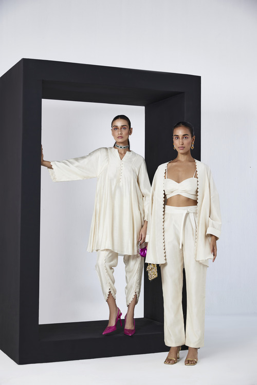Two models wearing beige chanderi silk co-ord sets 