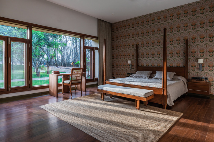 image of a bedroom in Shreyas Retreats - luxury wellness retreats in india